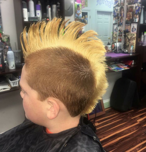 Boy with a longer blonde mohawk 